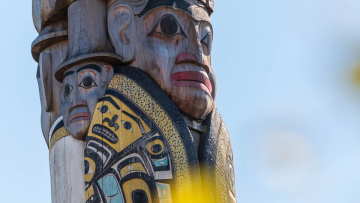 close-up shot of a carved face on the Reconciliation Pole at UBC's Vancouver campus