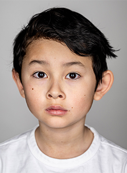 Close-up, brightly lit portrait of a young boy